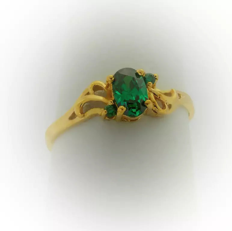 simple gold ring green stones