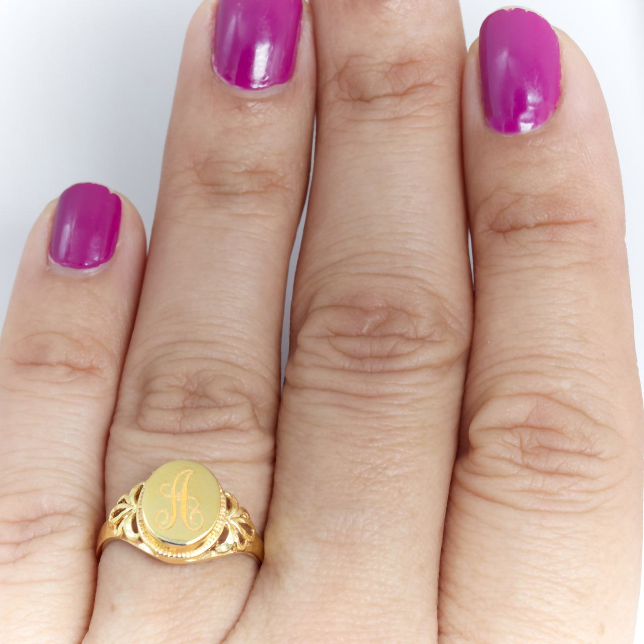 Signet ring personalized on women's finger