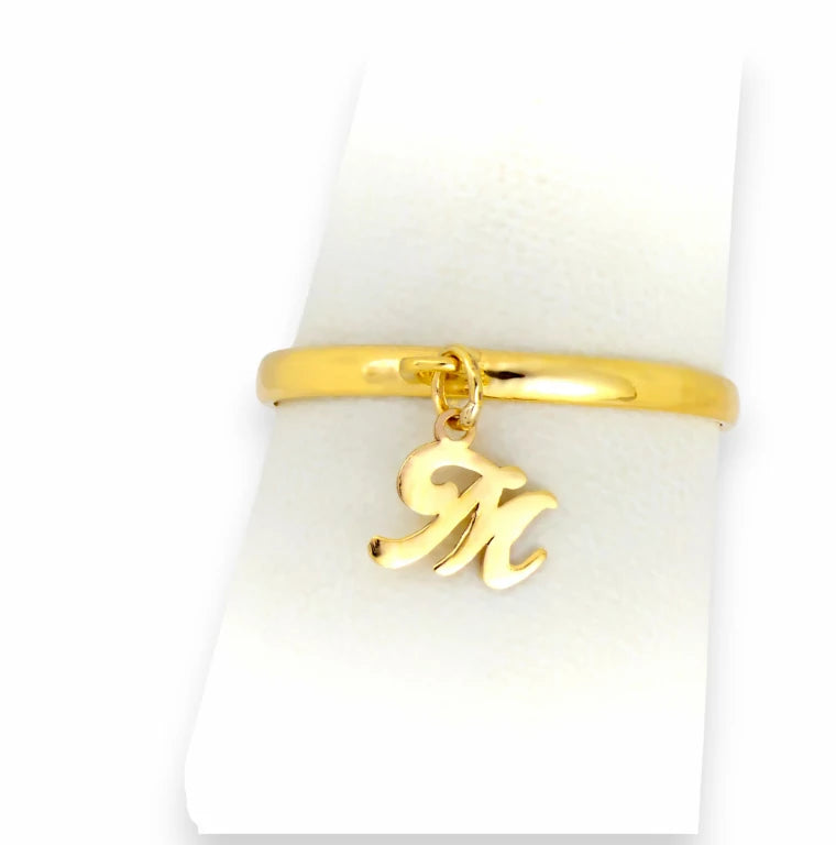 Front view of personalized custom initial M charm ring in real yellow gold, simple polished stackable band.