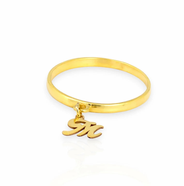 Side angle of small script initial M charm dangle ring, personalized real gold custom band for stacking.