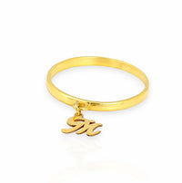 Side angle of small script initial M charm dangle ring, personalized real gold custom band for stacking.
